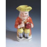 A Nineteenth Century Toby Jug, 25cm, chip to rim and stained crazing