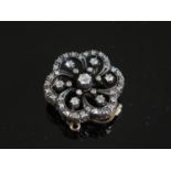 A Victorian Diamond Pendant Brooch, central diamond estimated .17ct, 25mm diam., 7.7g