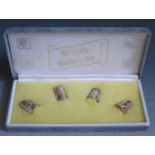 An Elizabeth II Cased 'British Hallmarks' Set of Four Collectors Thimbles with London, Birmingham,