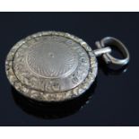 A Georgian Memorial Locket decorated with half length silhouette of a gentleman, 34mm diam.