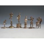 Two Silver Miniature Putti with import marks, three white metal and silver plated Putto on stand (