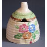 A Clarice Cliff Lynton Sundew Beehive Honey Pot, 3.25" high, c. 1936. Lid with crazing and tiny