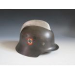 A WWII German 3rd Fireman's Helmet, rim stamped VDNS64