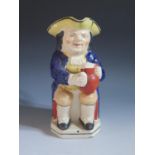 A Nineteenth Century Toby Jug, 24cm, crazing and staining, firing crack to handle and chips to base