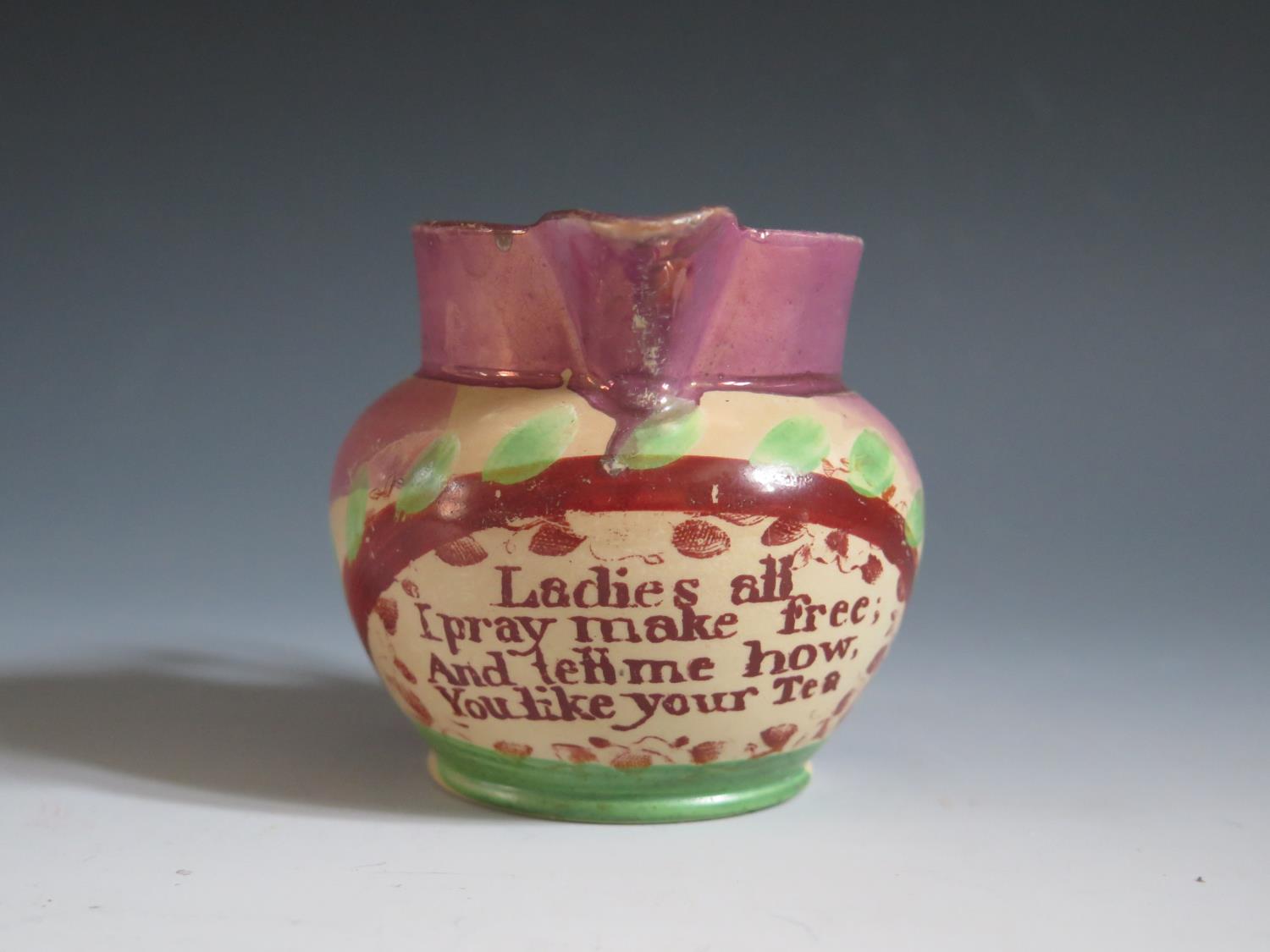 A Sunderland Lustre Milk Jug with polychrome decoration and poetic text 'Ladies all I pray make