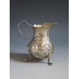 A George III Silver Creamer with embossed decoration of a swan and hair coursing, London 1748,