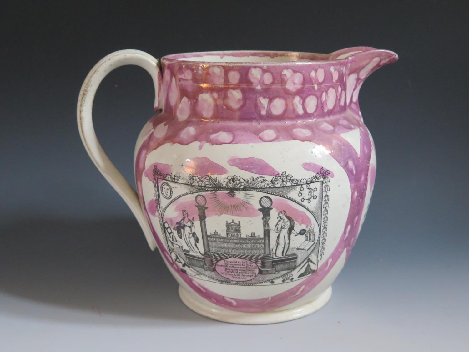 A Sunderland Lustre Jug decorated with monochrome transfers including Masonic scene with poetic