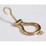A 9ct Gold (tested) Spring Loaded Miniature Button Hook Charm, 2.6g