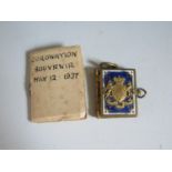 A Royal Commemorative Miniature Enamel Pendant Photograph Book celebtrating the cororantion of