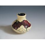 A Modern Moorcroft Chocolate Cosmos Pattern Squat Vase, base marked 2013, 6cm, boxed