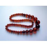 A Graduated Faux Orange Amber Bead Necklace, 62cm, 65.5g