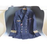 A WWII German Kriegsmarine Commander's Tunic with ribbons, label for Ernst Brendler