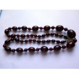 A Graduated Faux Opaque Cherry Amber Bead Necklace, 70cm, 42.8g, largest bead 23x18mm