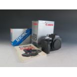 A Canon EOS 600 35mm SLR Camera Body (boxed with manual), Sekonic Digilite F model L-328 (boxed) and