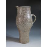 Michael Casson (1925-2003), a large stoneware pitcher with a mottled brown and grey glaze, incised