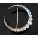 A Victorian Diamond Crescent Brooch in a precious yellow and white metal mount, largest diamond