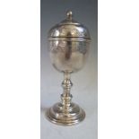 A White Metal Goblet and cover with chased foliate decoration, 17cm high, 178g