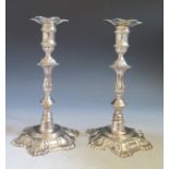 A Pair of Elizabeth II George II Style Cast Silver Candlesticks with detachable sconces,