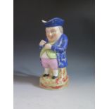 A Nineteenth Century Samson Staffordshire Style Porcelain Toby Jug, gilt anchor mark, 26cm, glaze