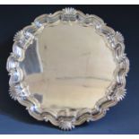 An Edward VIII Silver Piecrust Salver raised on three ball and tallon feet, London 1908, Thomas