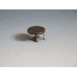 A Fine Dolls House Miniature White Metal Tilt Top Breakfast Table with niello decorated top and