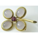 A French 18ct Gold, Moonstone and Ruby Flower Head Brooch, 20.3g, 50mm high, ruby 7mm diam., eagle