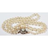 A Graduated Pearl Single Strand Necklace with old cut diamond and pearl unmarked gold clasp, 14.