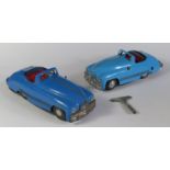Two Triang Minic Geared No. 2 Sports Cars in light blue and dark blue. One motor needs attention.