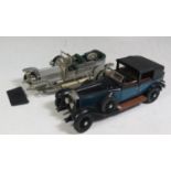 Two Franklin Mint 1:24 Rolls-Royce Models. Both have some damage.