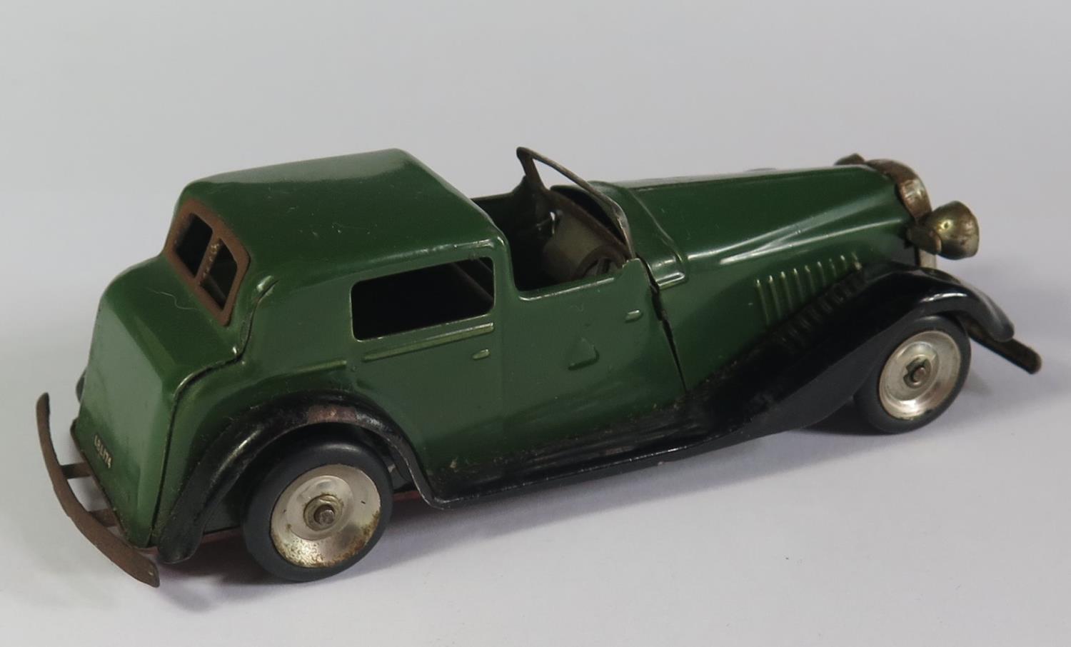 A Triang Minic 18M Vauxhall Town Coupe Car in green and black with red base. Working motor with key - Image 2 of 3