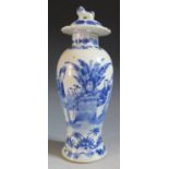 An 18th Century Chinese Blue and White Porcelain Baluster Vase with cover, decorated with a lady