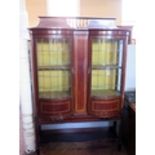 An Edwardian Mahogany and Inlaid Display Cabinet by Henry Barker of Nottingham with twin bow fronted