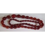 A Faux Orange Red Amber Bead Necklace, 93cm, largest bead 29x21mm, 106g