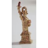 A 14K Gold and Red Enamel Charm in the form of The Statue of Liberty, 2.9g, 25mm high