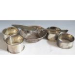 A Pair of Edward VII Silver Napkin Rings Sheffield 1907 P Ashberry & Sons, two other napkin rings,