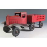 An Unusual Articulated Stake Truck. Tires marked "GIRARD - BALLOON - USA" (26cm approx).