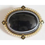 A Large Victorian Banded Onyx and Pearl Brooch in an unmarked high carat gold setting with black