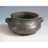 A Chinese Bronze Censer with bird and bat border and mask handles, four character mark to base, 14.