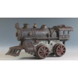 An Early American Flyer Cast Iron Locomotive Clockwork Train in working condition (17cm approx).