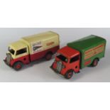 Two Triang Minic Clockwork 85M Delivery Vans. One is in red and green "MINIC TRANSPORT" the other is