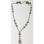 A 19th Century Citrine and unmarked silver necklace, largest stone 19x 13mm, drop c. 7cm, chain.