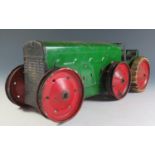 A Scarce Triang Clockwork Tinplate No. 3 6 Wheeled Tractor in green with red wheels, motor works.