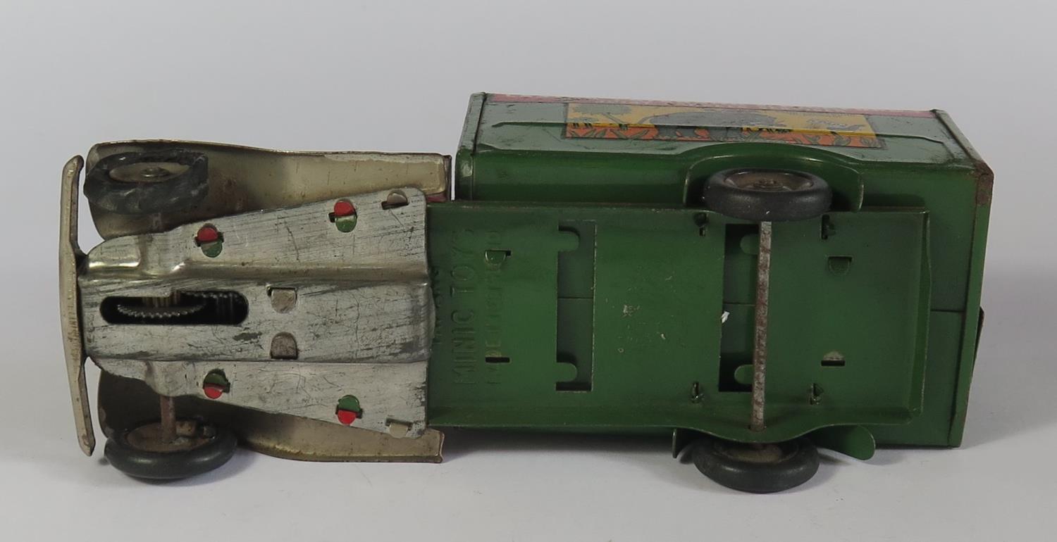A Triang Minic Clockwork 22M Delivery Van in red and green with decals "Carter Peterson & - Image 3 of 3