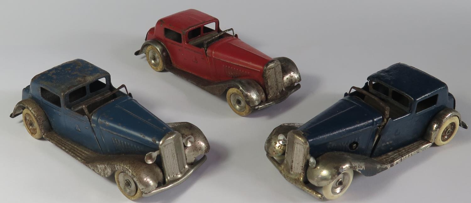 Three Triang Minic 18M Vauxhall Town Coupe Cars in blue and red with chrome. One motor needs