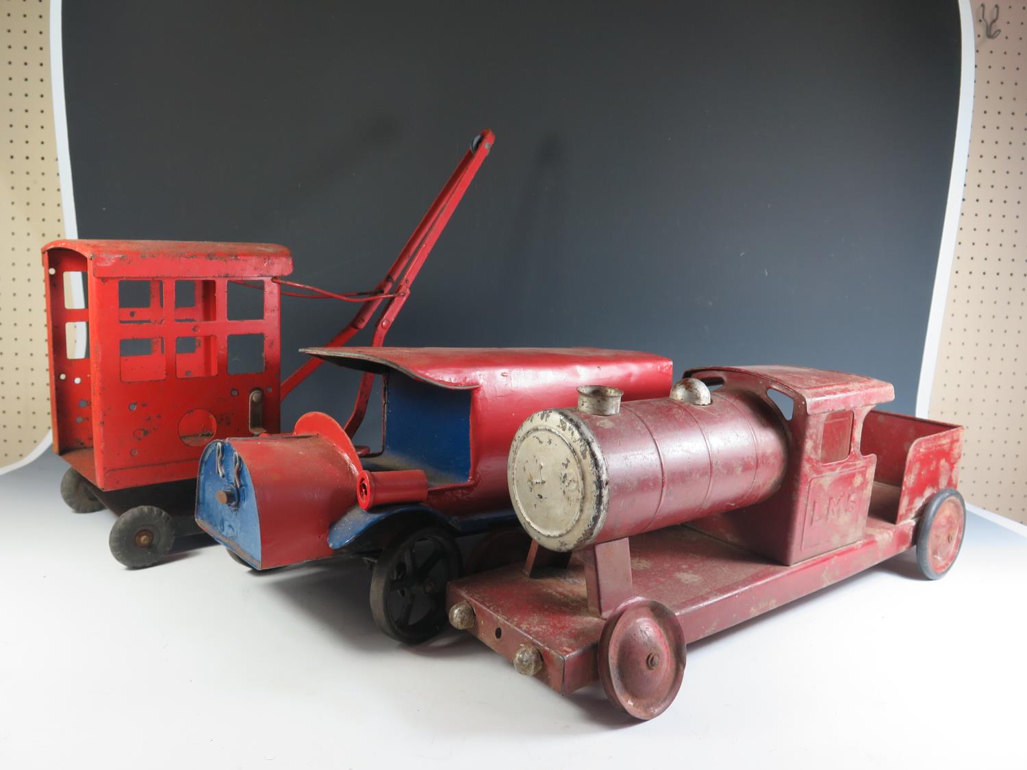A Large Tinplate Train and Crane (possibly Triang) and one other.