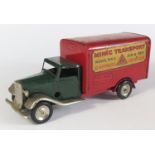 A Triang Minic Clockwork 22M Delivery Van in dark green and red with decals "Minic Transport".