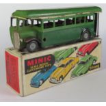 A Triang Minic Clockwork 52M Single Deck Bus in green and dark green. Working Motor in good complete