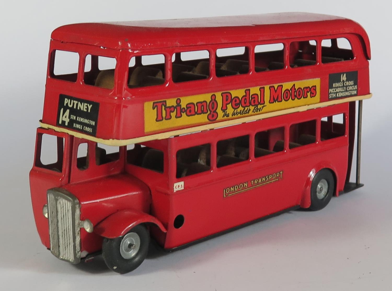 A Triang Minic Clockwork 60M Double Deck Bus in red with "Tri-ang Pedal Motors" and "FROG