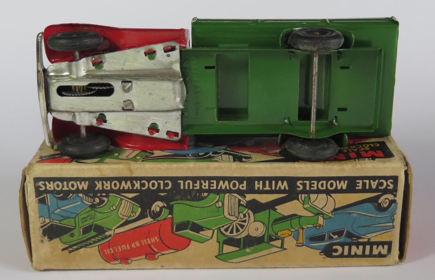 A Triang Minic Clockwork Delivery Lorry in red and green with black hubs. It is in near mint working - Image 3 of 3