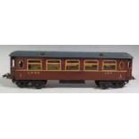 A Hornby O Gauge Tinplate First Class Passenger Coach "LNER 137" in good condition.